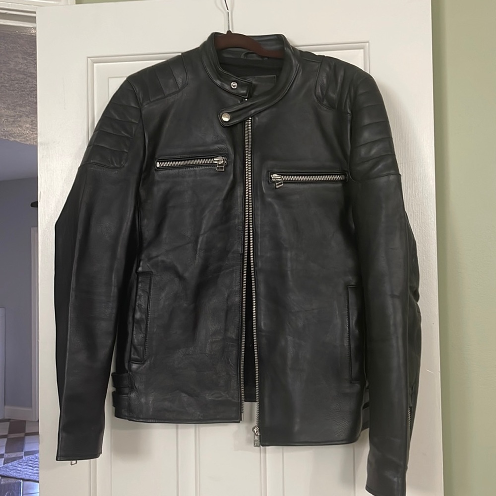 Men’s heavy black leather jacket. Brand is Goosecraft.